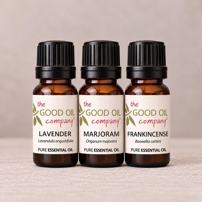 Evening Balance Essential Oil Trio with three 10ml bottles of Lavender, Sweet Marjoram and Frankincense on a neutral linen background.